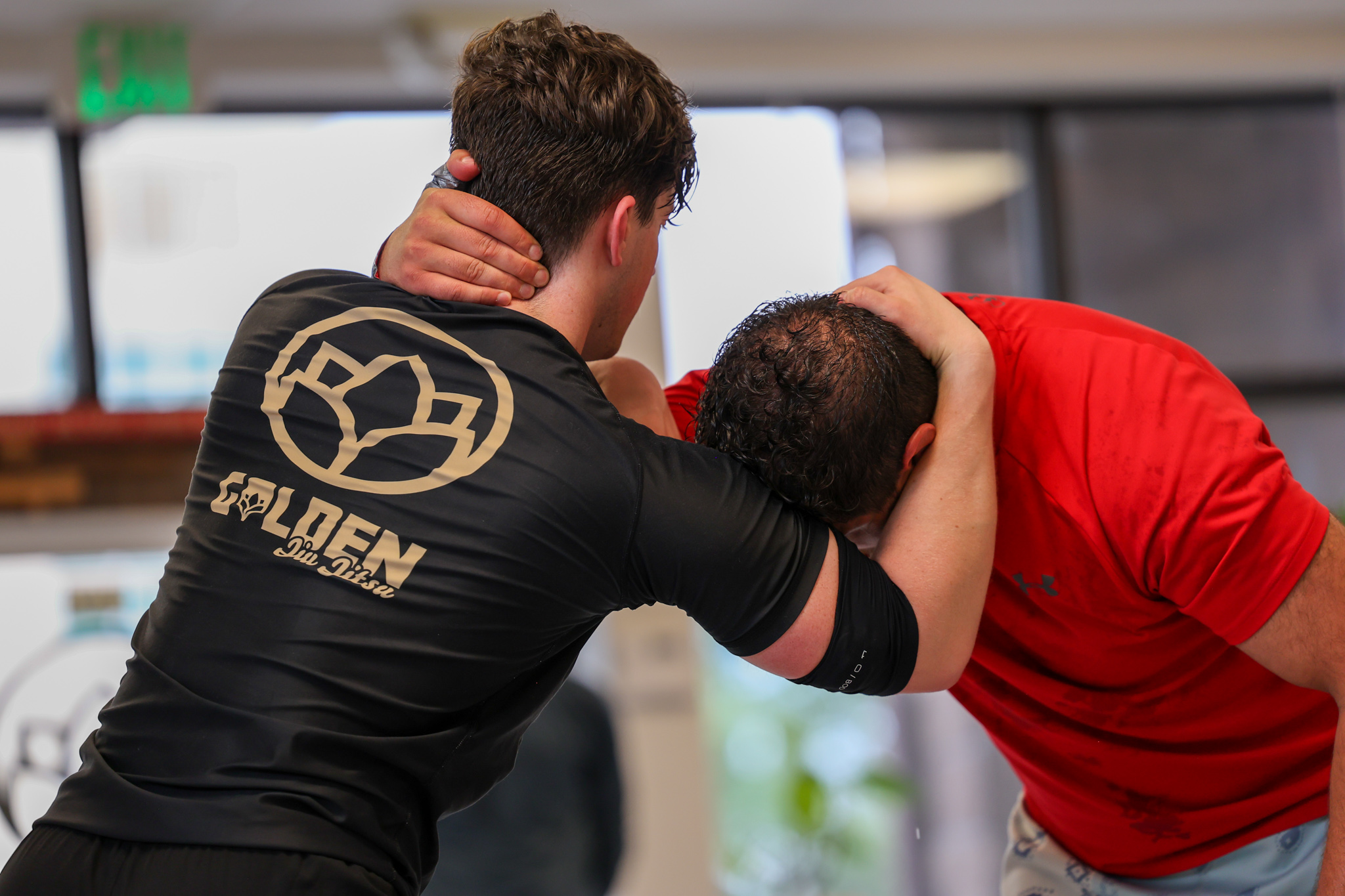 Two members drilling standup grappling at Golden Jiu Jitsu