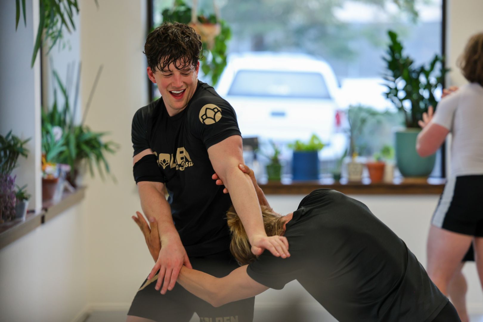 Members smiling while training at Golden Jiu Jitsu in Golden, Colorado