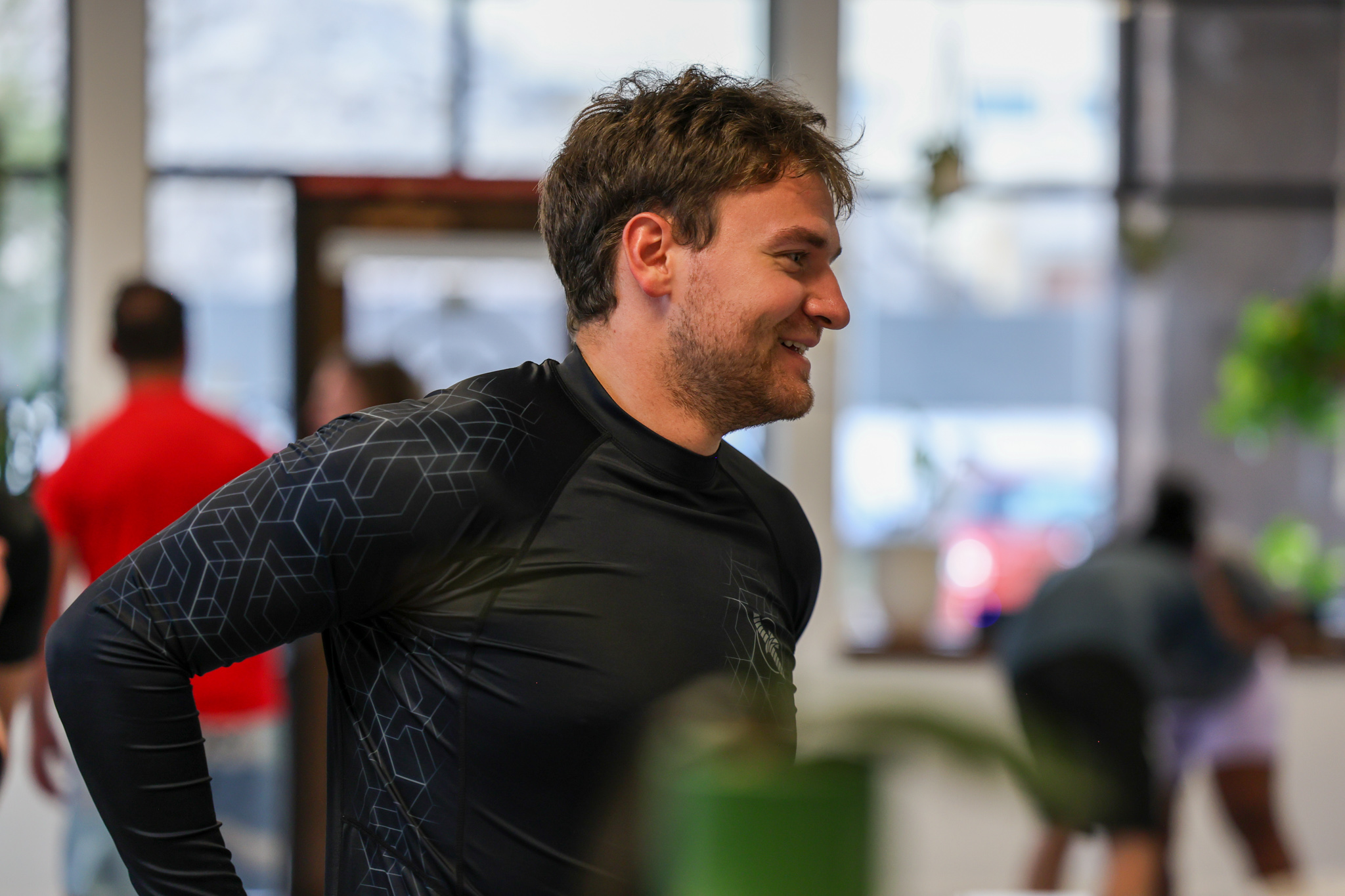 Member smiling between rounds at Golden Jiu Jitsu